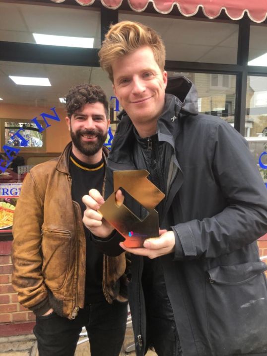 Foals, pictured in Peckham, London, with their Official Number 1 Album Award from the Official Charts Company for Everything Saved Will Not Be Lost – Part 2 [Credit: Phil Christie]