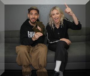 Linkin Park’s Mike Shinoda and Emily Armstrong pose with their Official Number 1 Album Award from Official Charts for From Zero (credit: Official Charts)